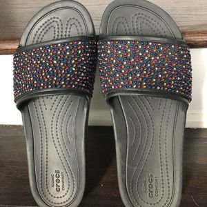 Crocs rainbow flip flops